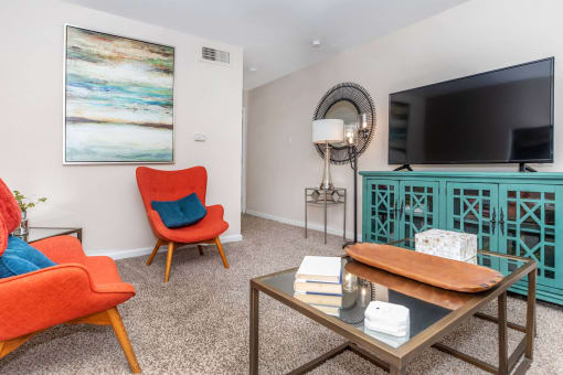 Living room with couch and tv at Royal Wildewood Manor Apartments, Clute, 77531