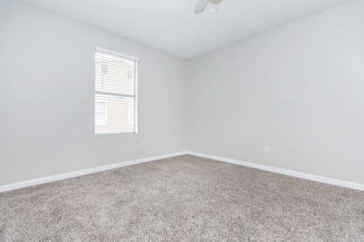 Unfurnished room with wooden tiles at Royal Wildewood Manor Apartments, Texas, 77531