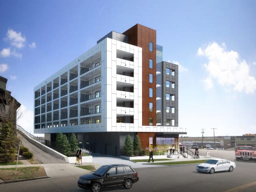 a rendering of an apartment building with cars parked in front of it