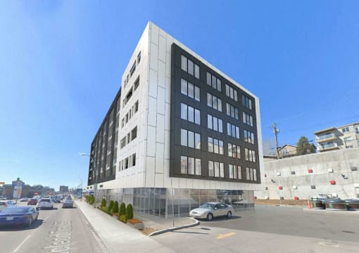 a large building on a city street with cars