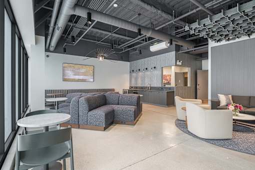 A modern office space with a grey and white color scheme.