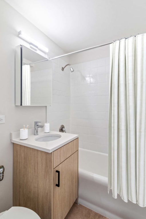 a bathroom with a sink and a shower