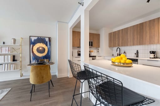 a rendering of a dining room with a geometric design on the wall