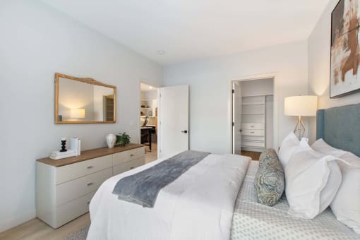 a bedroom with a bed and a closet