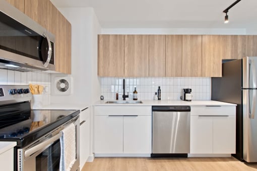 a kitchen with a sink and a refrigerator