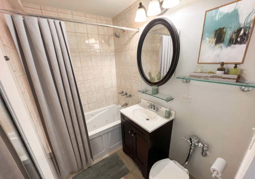 a small bathroom with a shower and a sink and a toilet