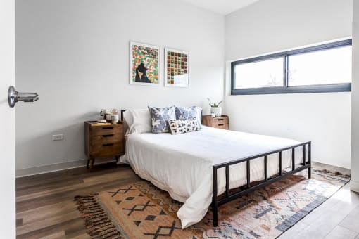 a bedroom with a bed and a window