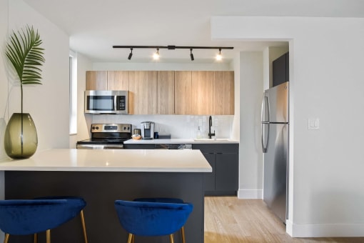 a kitchen with a counter top and a refrigerator