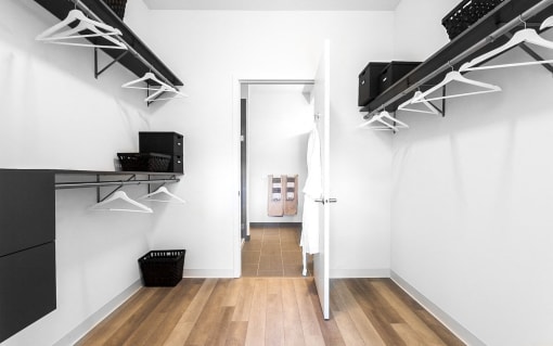 a room with a closet and a mirror and a door