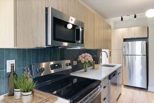 a kitchen with stainless steel appliances and a stove