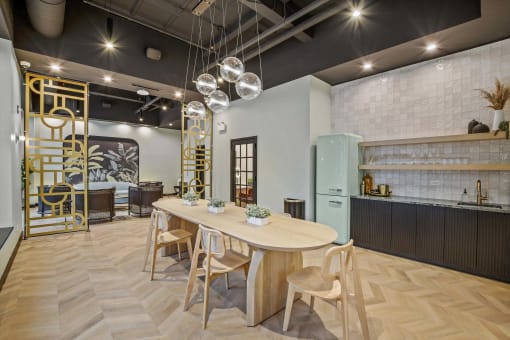 a dining room and kitchen with a large table and chairs