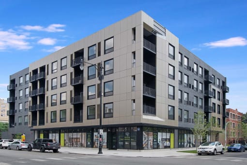 a new apartment building on the corner of a city street