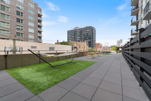 a grassy area on the roof of an apartment building