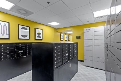 a view of a locker room with lockers and a yellow wall