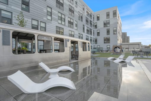 a reflection of a building in a pool of water