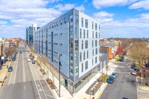 a large blue building on the corner of a city street