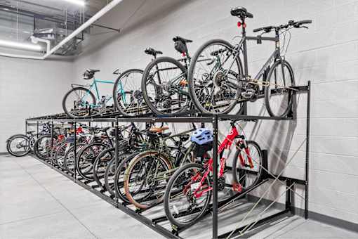 A bike rack with multiple bicycles parked on it.