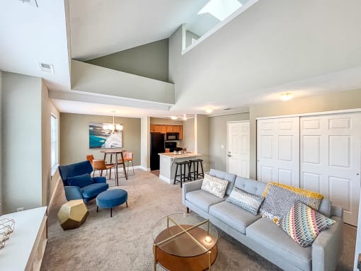 2-bedroom apartment with loft apartment showing great room, front entrance, closet space, and vaulted ceilings