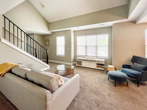 2-story loft apartment great room living area with large, bright windows