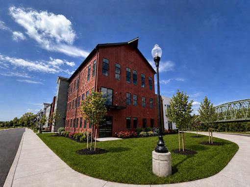 An image of the front of Westport Crossing with the Erie Canal in the background.