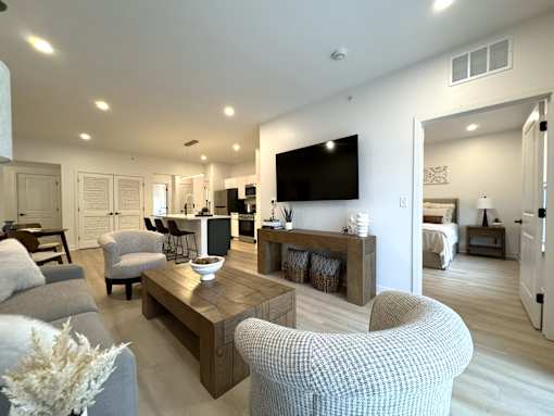 View of typical great room living area and entrance to primary bedroom