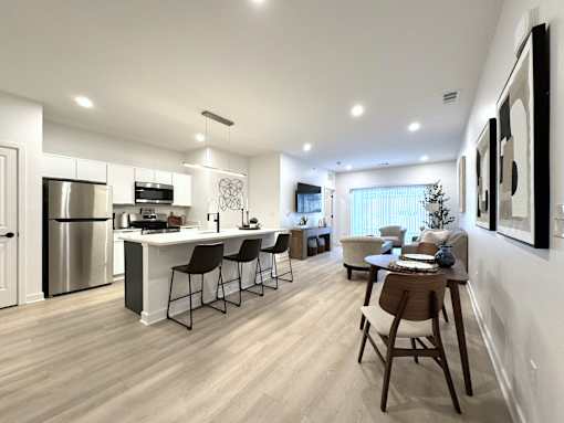 View of typical kitchen and great room area from the front entrance hallway