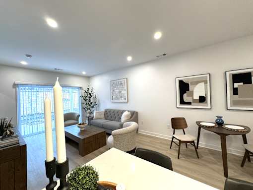 View of great room towards dining & living area and sliding glass doors to private patio