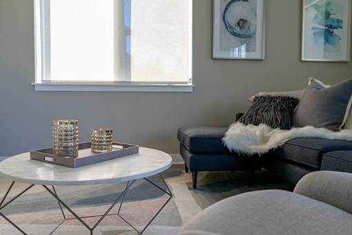 a living room with a couch and a table