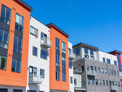 Exterior view of south wall of 625 S. Goodman Apartments showing balconies and windows