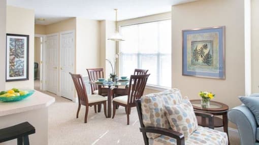 View from near kitchen breakfast bar of great room living and dining areas and hallway to bedroom View from near kitchen breakfast bar of great room living and dining areas and hallway to bedroom