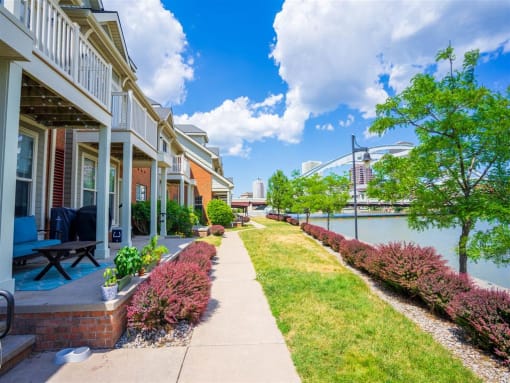 View from sidewalk in front of private apartment porches and balconies towards downtown Rochester and the "Freddie Sue" arched bridge over the Genesee River View from sidewalk in front of private apartment porches and balconies towards downtown Rochester and the "Freddie Sue" arched bridge over the Genesee River