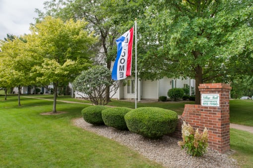 View of Village Walk entrance sign from the corner of Reynolds Road and Dean Spring Drive
