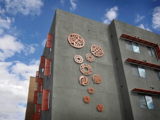 a building with a bunch of buttons on the side of it