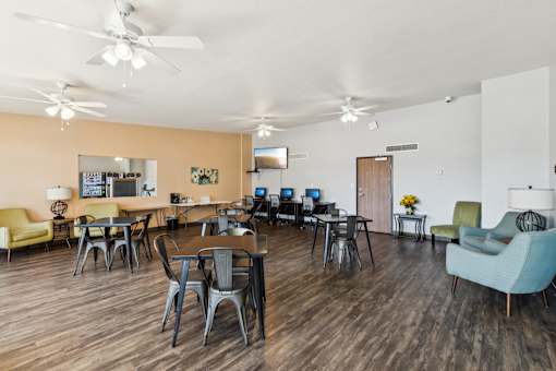 A room with a table and chairs in it.