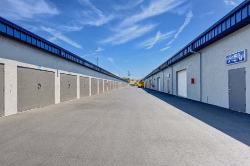 the inside of an industrial building with many garage doors
