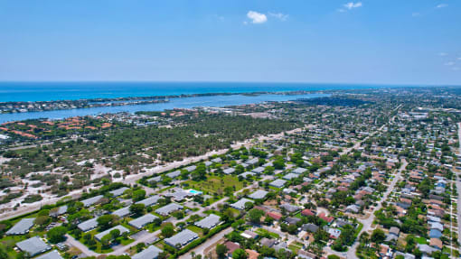 an aerial view of a city and the ocean