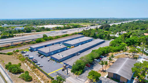 an aerial view of a factory with an empty parking lot