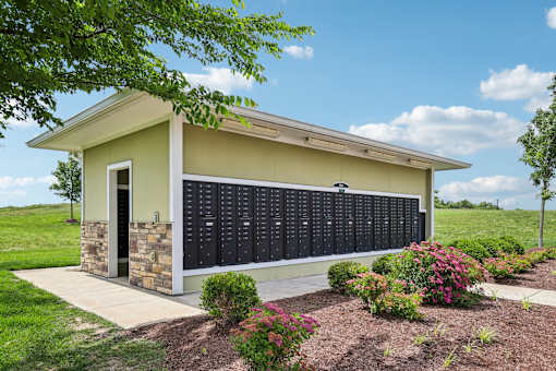 A small building with a row of plaques on the wall at Venue at 109 Apartments, Tennessee, 37090