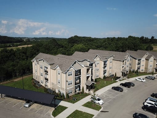 an aerial view of a large apartment complex with a parking lot and trees in the background at Venue at 109 Apartments, Lebanon , TN, 37090
