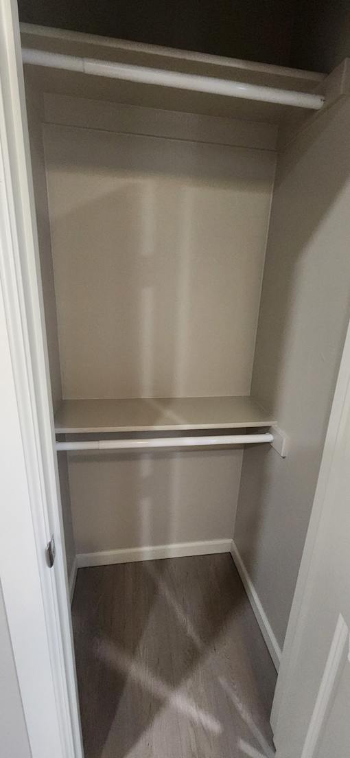 A white closet with the door open.