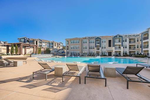 Pool surrounded by lounge chair at Edge and Stone, San Antonio, Texas