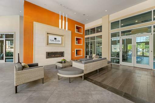 A living room with a fireplace and a couch.