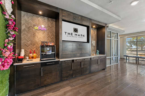 A coffee shop named The Mark is located in a modern building.