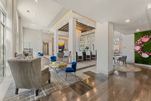 A large room with a lot of furniture and a mural of flowers on the wall.