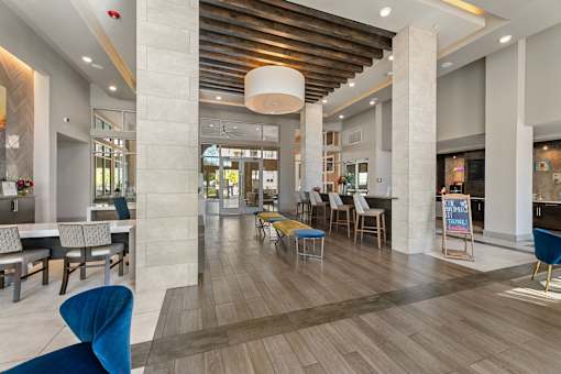 A large open space with a dining area and a bar.