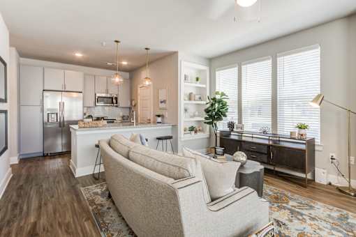 Living room and Modern kitchen with a refrigerator, microwave, and oven at Bellary Flats, South Carolina