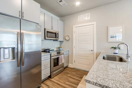 Fully Equipped Kitchen Includes Frost-Free Refrigerator, Electric Range, & Dishwasher at Bellary Flats, Summerville, 29486