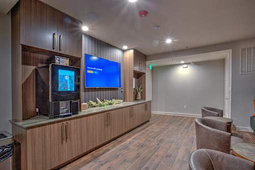 A room with wooden floors and a television on a wooden cabinet.
