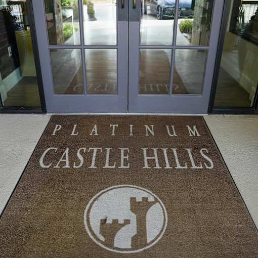 a welcome mat in front of a door to platinum castle hills