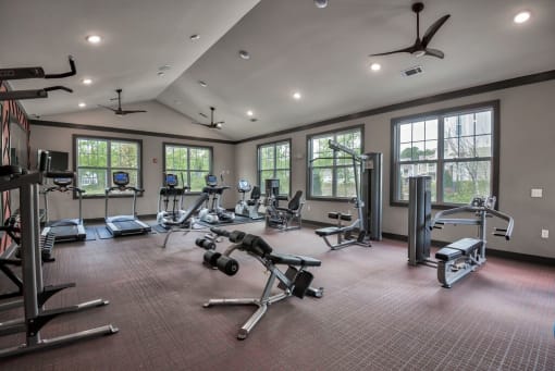 a gym with exercise equipment and windows at Sterling Creek, Richmond Hill, 31324